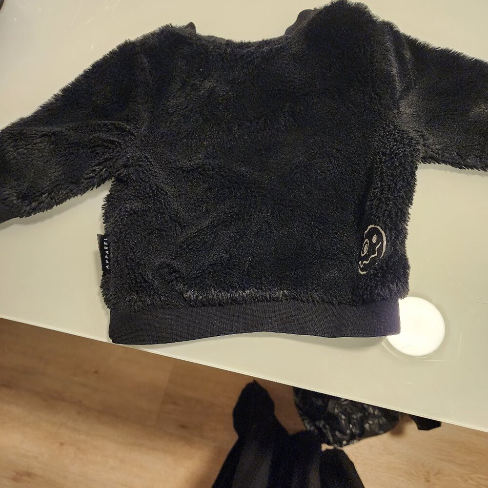 Load baby sweater
